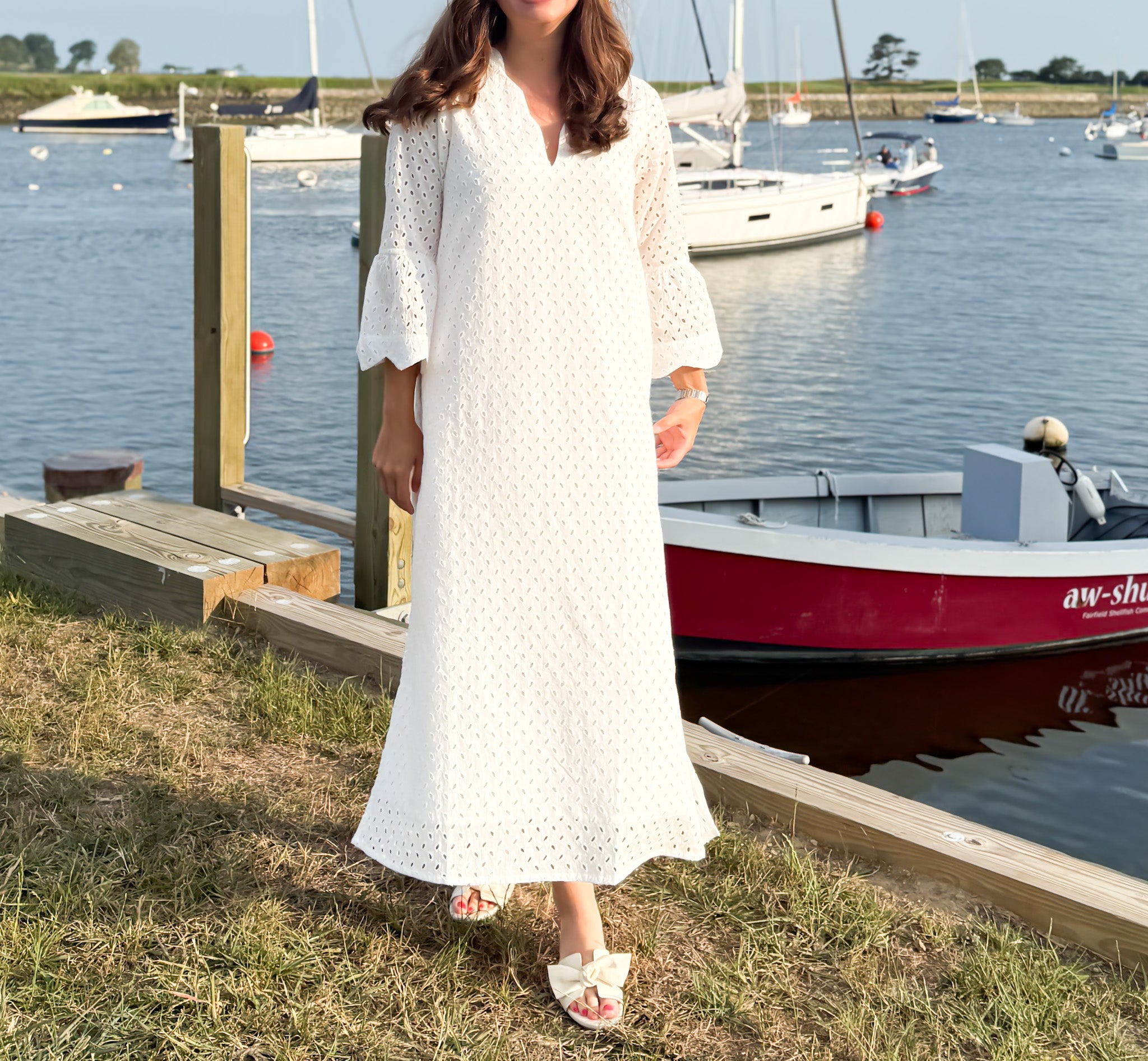 The Amy Caftan by Sara Khatib Design a flattering maxi length caftan in off white eyelet with bell sleeves and scalloped trim neckline with open side slits